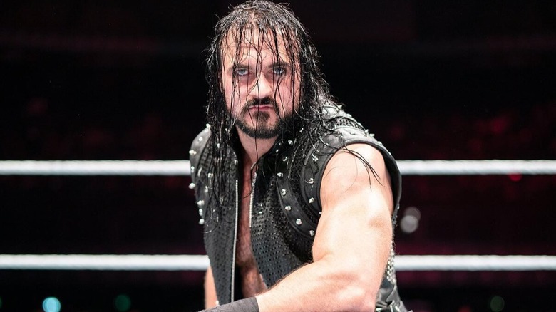 Drew McIntyre kneels in the center of the WWE ring