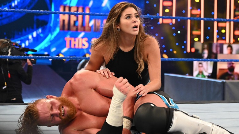 Aalyah Mysterio cradling Murphy (Buddy Matthews) on an episode of "SmackDown," 2020.