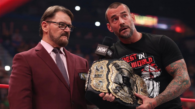 Tony Schiavone and CM Punk during the promo where Punk declared himself the Real AEW World Champion