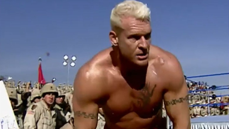 Heidenreich stands hunched over after losing a match to The Undertaker during a WWE Tribute to the Troops event.