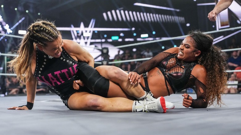 Nattie grapples with Jaida Parker on the mat on 
