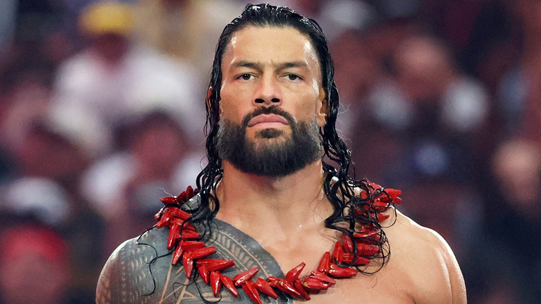 Roman Reigns wearing red ula fala necklace