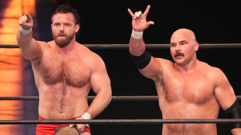 Cash Wheeler and Dax Harwood standing in a wrestling ring