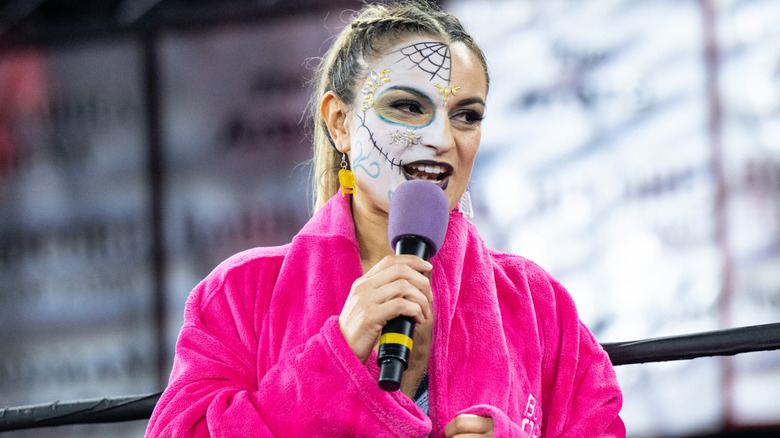Thunder Rosa holding a microphone