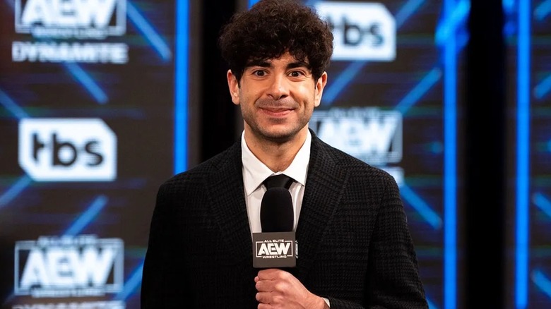 AEW President and CEO Tony Khan awaits to make an announcement backstage