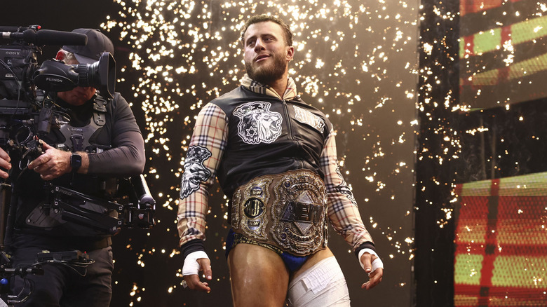 AEW World Champion MJF stands on the stage, flanked by a camera man, during his entrance before a match on the June 17, 2026 edition of "AEW Dynamite."