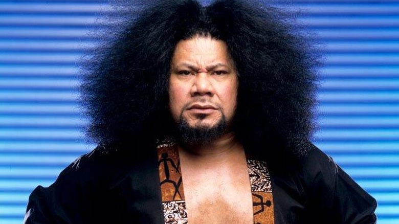 Haku posing during a promotional shoot with WWE.