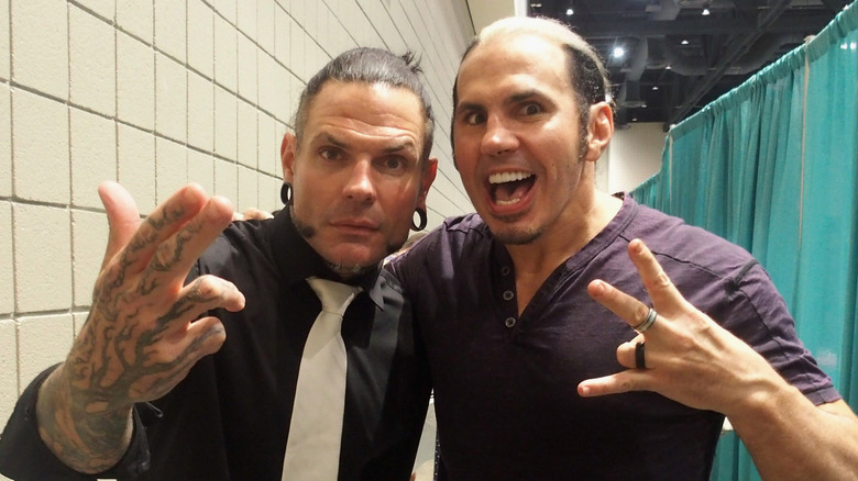 Jeff and Matt Hardy standing next to another another