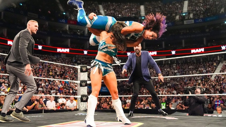 Lyra Valkyria delivers a Nightwing to Bayley during her heel turn, as officials stand by and watch, on the June 22, 2026 edition of 