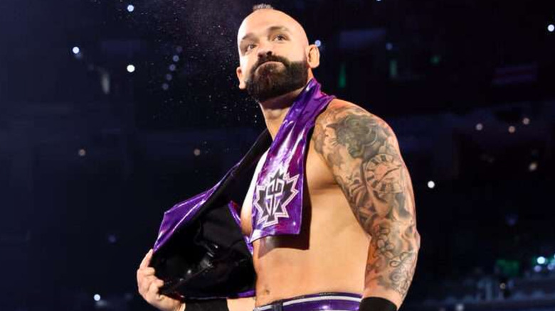 Shawn Spears wearing a maroon scarf