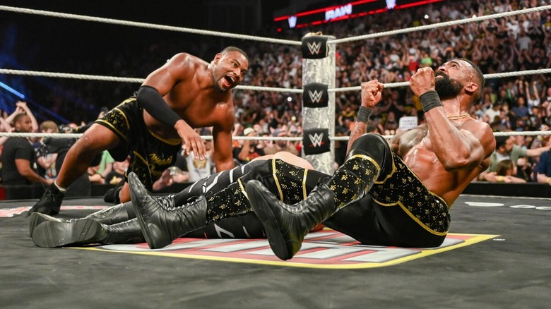 The Street Profits celebrate their tag team title win