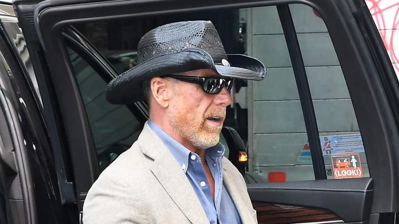 Shawn Michaels exits a car