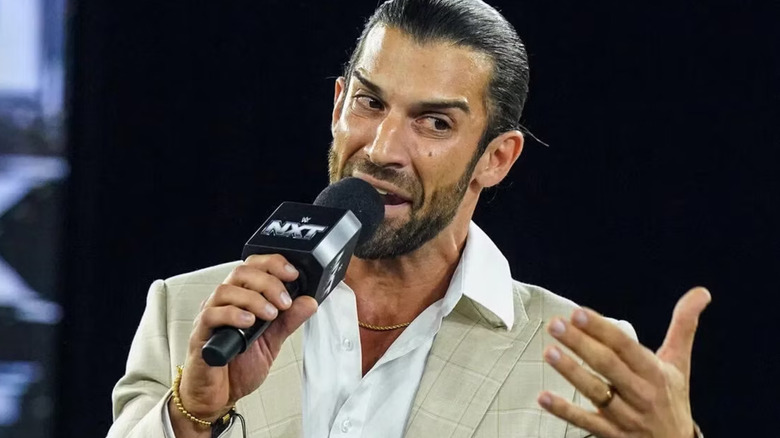 Robert Stone holding a microphone