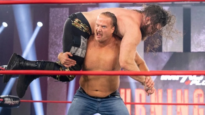 Joe Doering hoists Jake Something up on his shoulders during their match at Impact's 