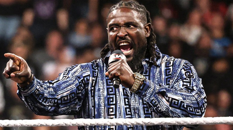 Oba Femi during a promo declaring that he would retire Brock Lesnar during an episode of 
