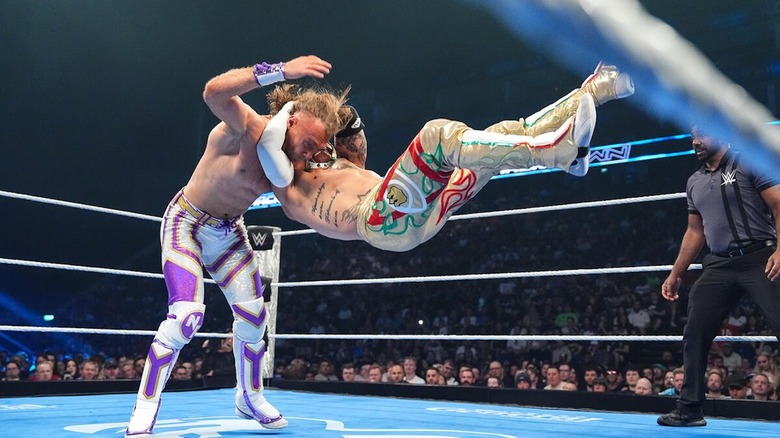 Rey Fenix hits a cutter on Nathan Frazer on 