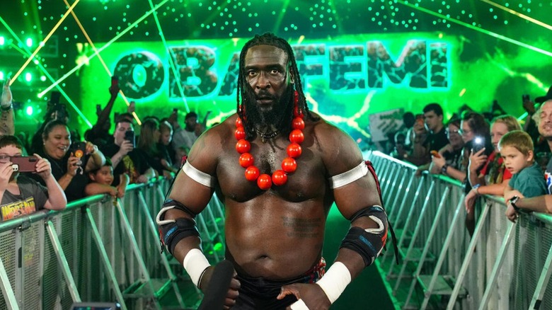 Oba Femi struts down to the ring before a King of the Ring tournament match on 