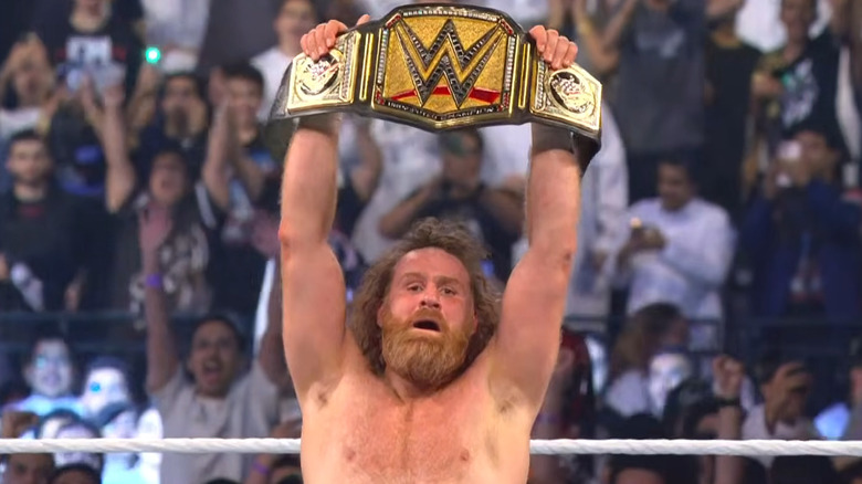 Sami Zayn holding up the Undisputed WWE Championship