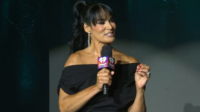 Traci Brooks holding a microphone