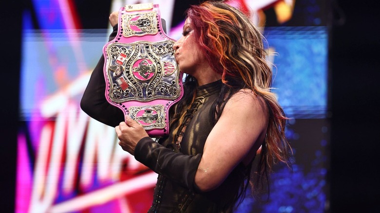 Mercedes Mone kisses the women's Owen Hart Cup title belt on 
