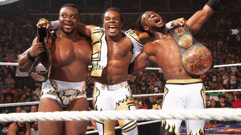 Big E, Xavier Woods, and Kofi Kingston celebrating a win at SummerSlam.