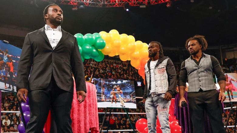 Big E feels the cold shoulder as he processes what Kofi Kingston and Xavier Woods just said to him during their celebration event on 