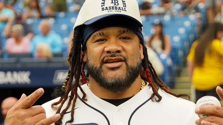 Jacob Fatu poses at a baseball game