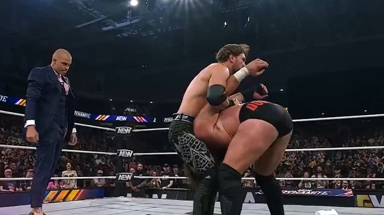 Kyle Fletcher appears behind Will Ospreay while he wrestles Mark Davis
