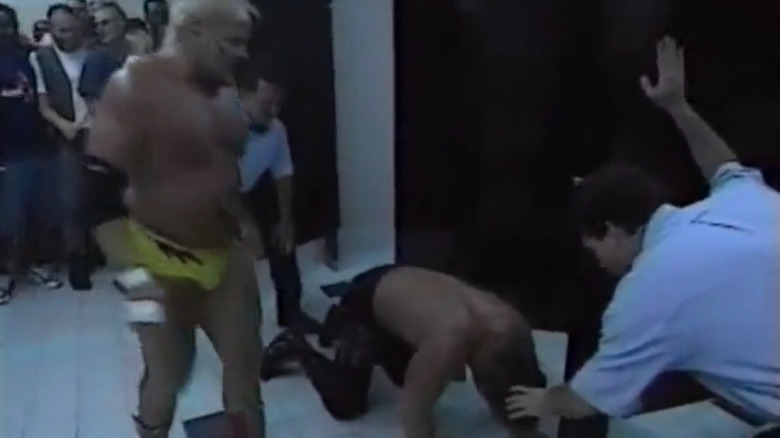 Kevin Sullivan and Chris Benoit battle in the men's bathroom at WCW Great American Bash 1996
