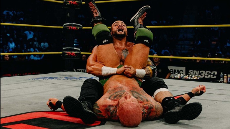 Mike Santana pinning Eric Young