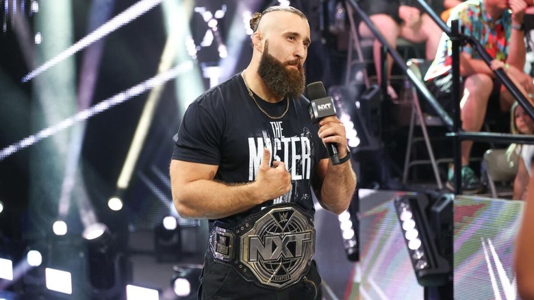 NXT Champion Tony D'Angelo stands on the ramp and cuts a promo to the other stars in the ring during an episode of "WWE NXT."