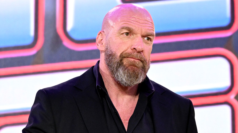 WWE CCO Triple H awaits a question from the crowd