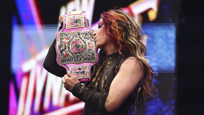 Mercedes Mone kisses the Owen Hart Foundation Women's Championship after a victory over Hazuki on "AEW Dynamite."