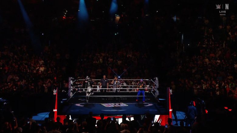 Penta and Rey in the ring during the announcement