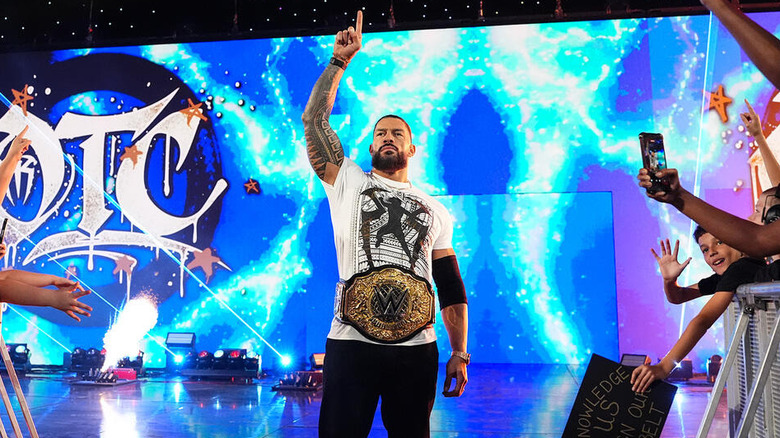 Roman Reigns lifts a finger in the air on "WWE Raw"